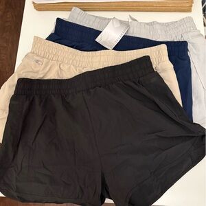 New SoothFeel Athletic Shorts Set 4 in Black, Beige, Blue, and Gray size large